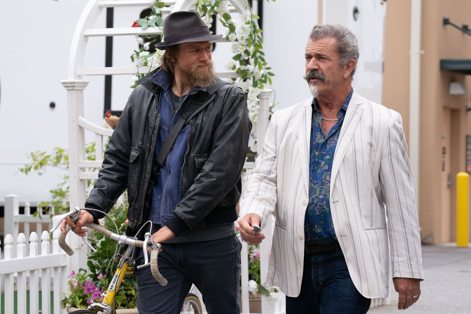 Review: ‘Last Looks’Charlie Hunnam And Mel Gibson Comically Navigate A Murder Mystery